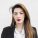 business-woman-black-jacket-looking-camera