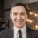 smiling-man-suit-looking-camera