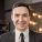 smiling-man-suit-looking-camera